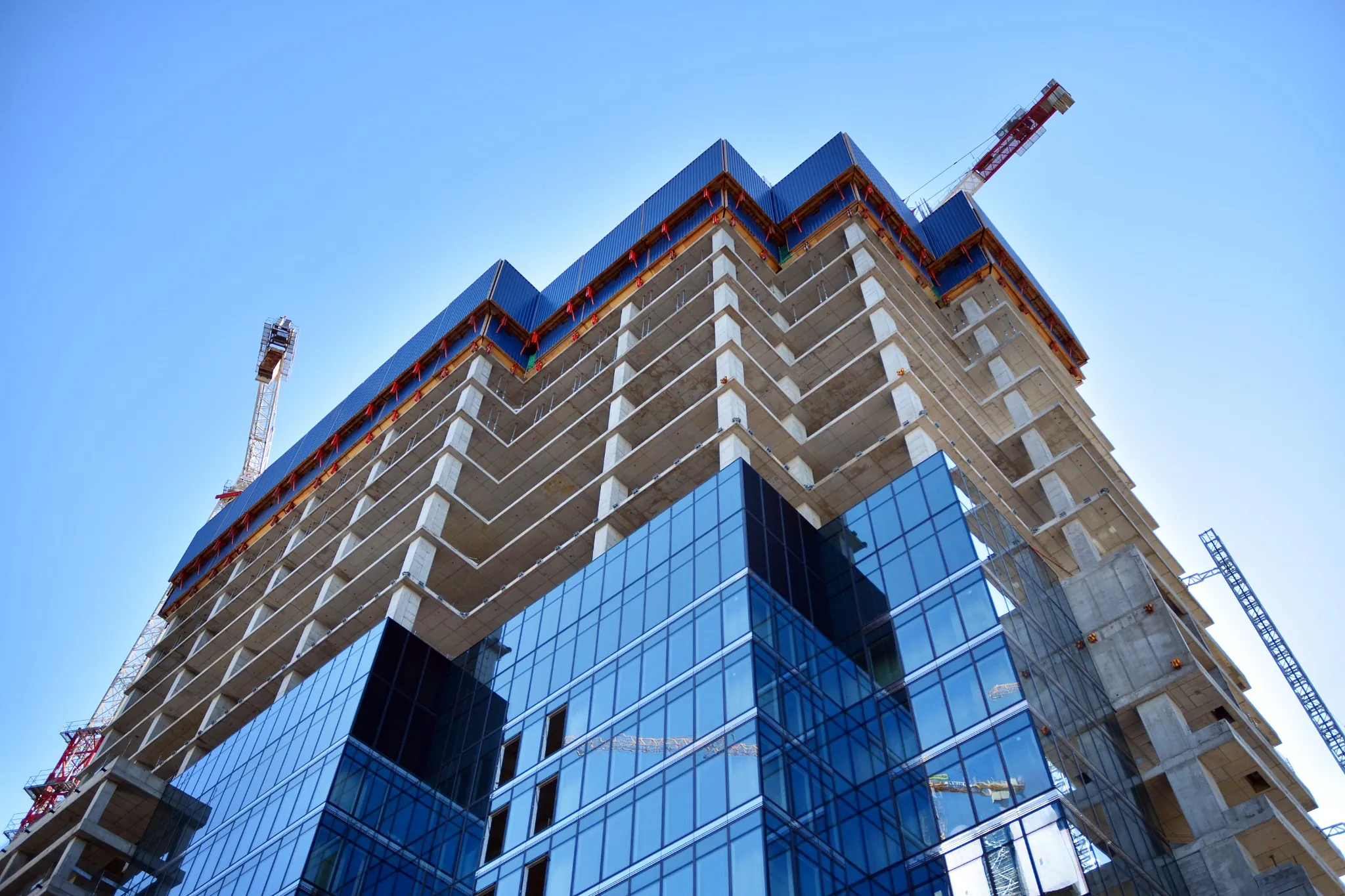 vecteezy_high-rise-building-under-construction-modern-office-building_33829957